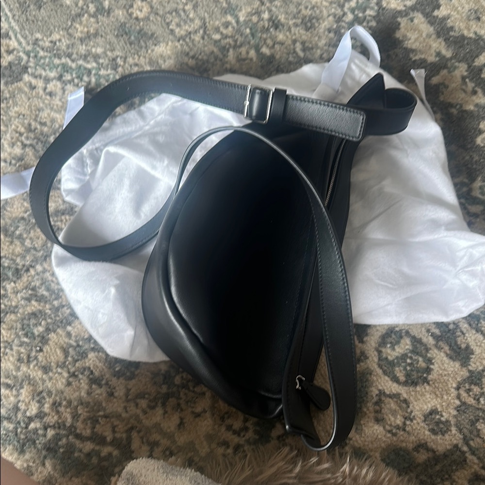 The row Banana Bag (small) 
Elegant Black Crossbody Bag